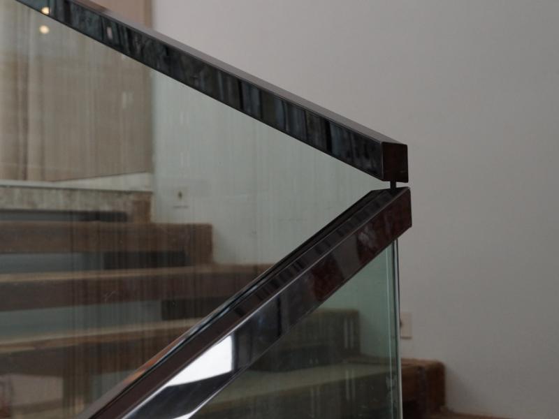 PVD Black Stainless Steel Handrail of 50x50 Square section top mounted on glass for staircase railing